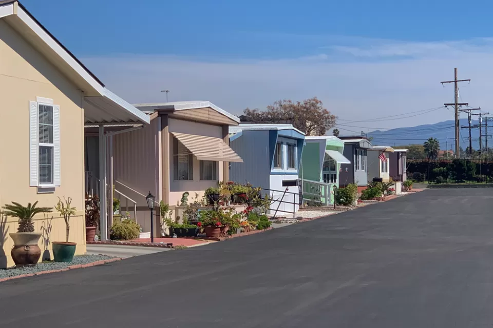 Row of manufactured homes on an asphalt street
